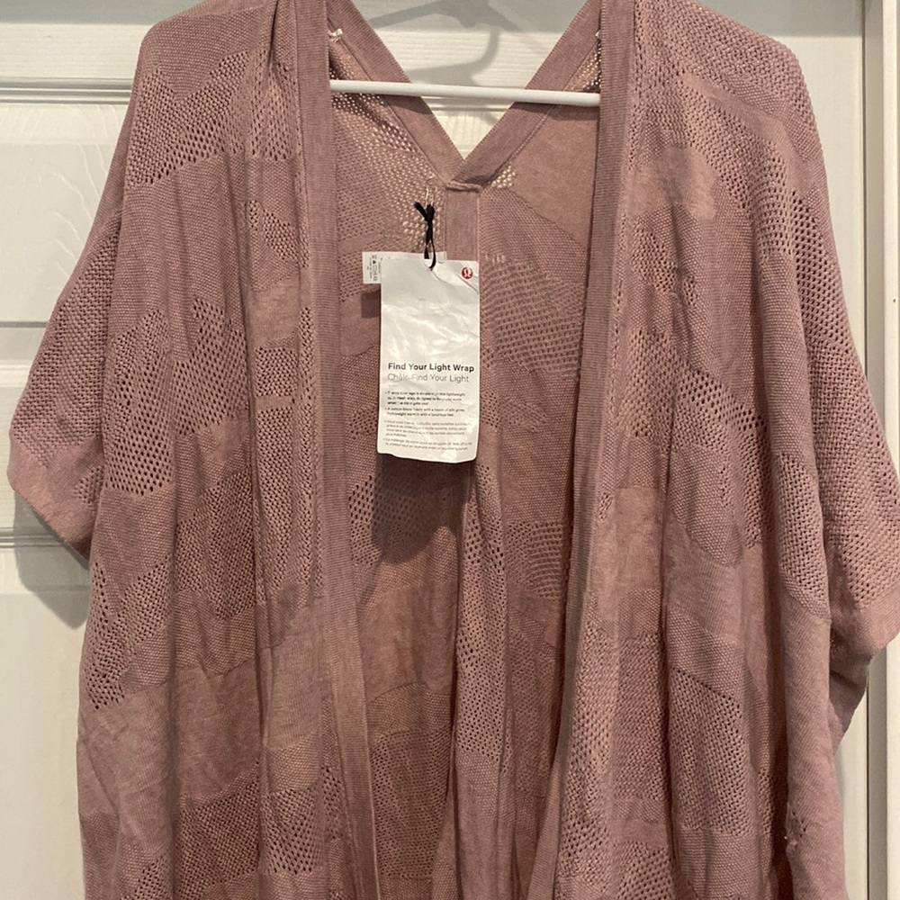 Lululemon wrap in light dusty pink/purple. One size fits most. NWT
